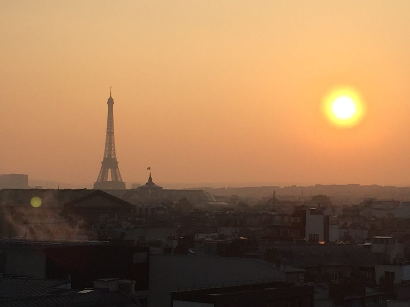 yellow sun and Eiffel Tower