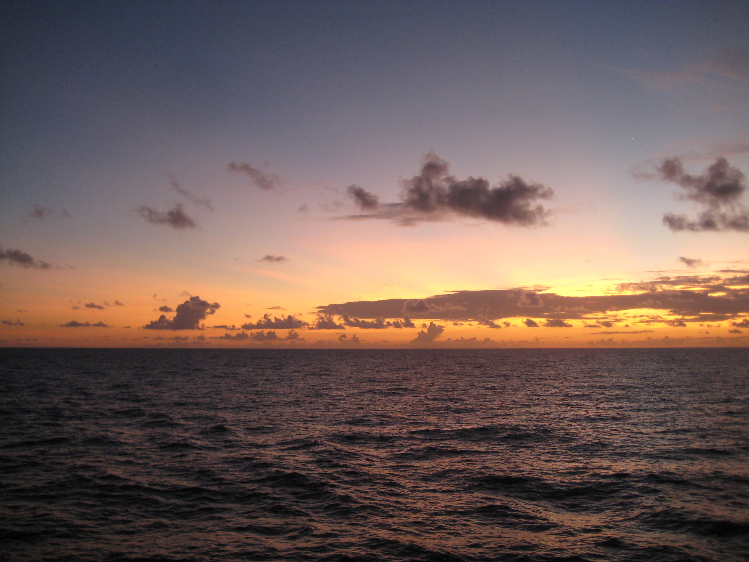 sun and clouds over the ocean