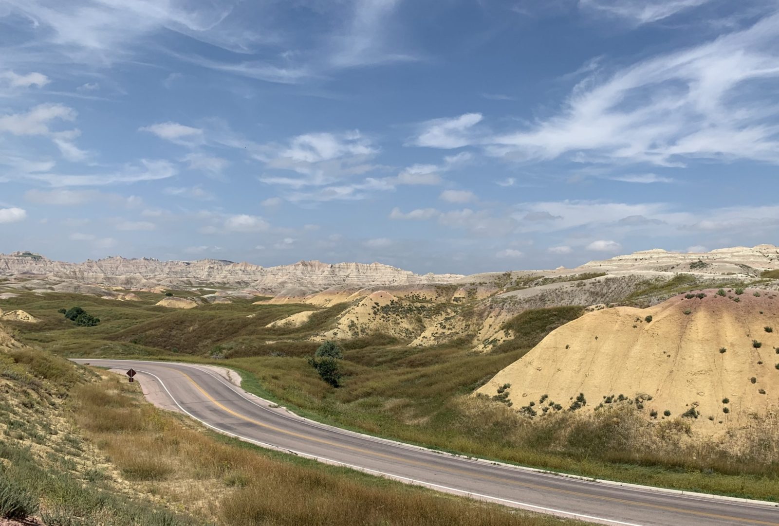 view of brown hills and road