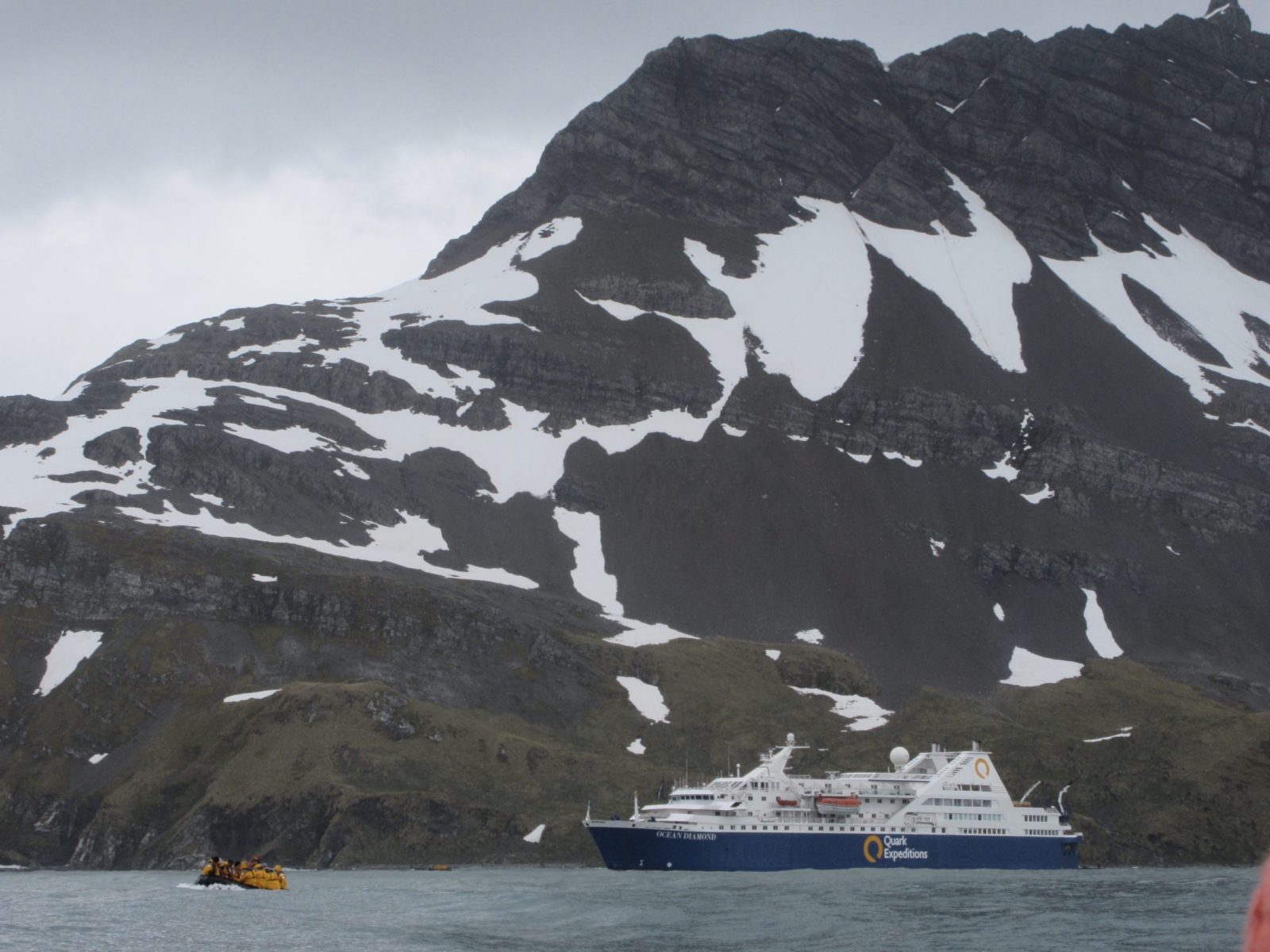 cruise ship near mountains