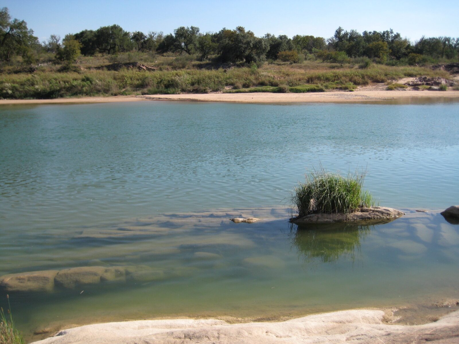 blue river with sandy banks