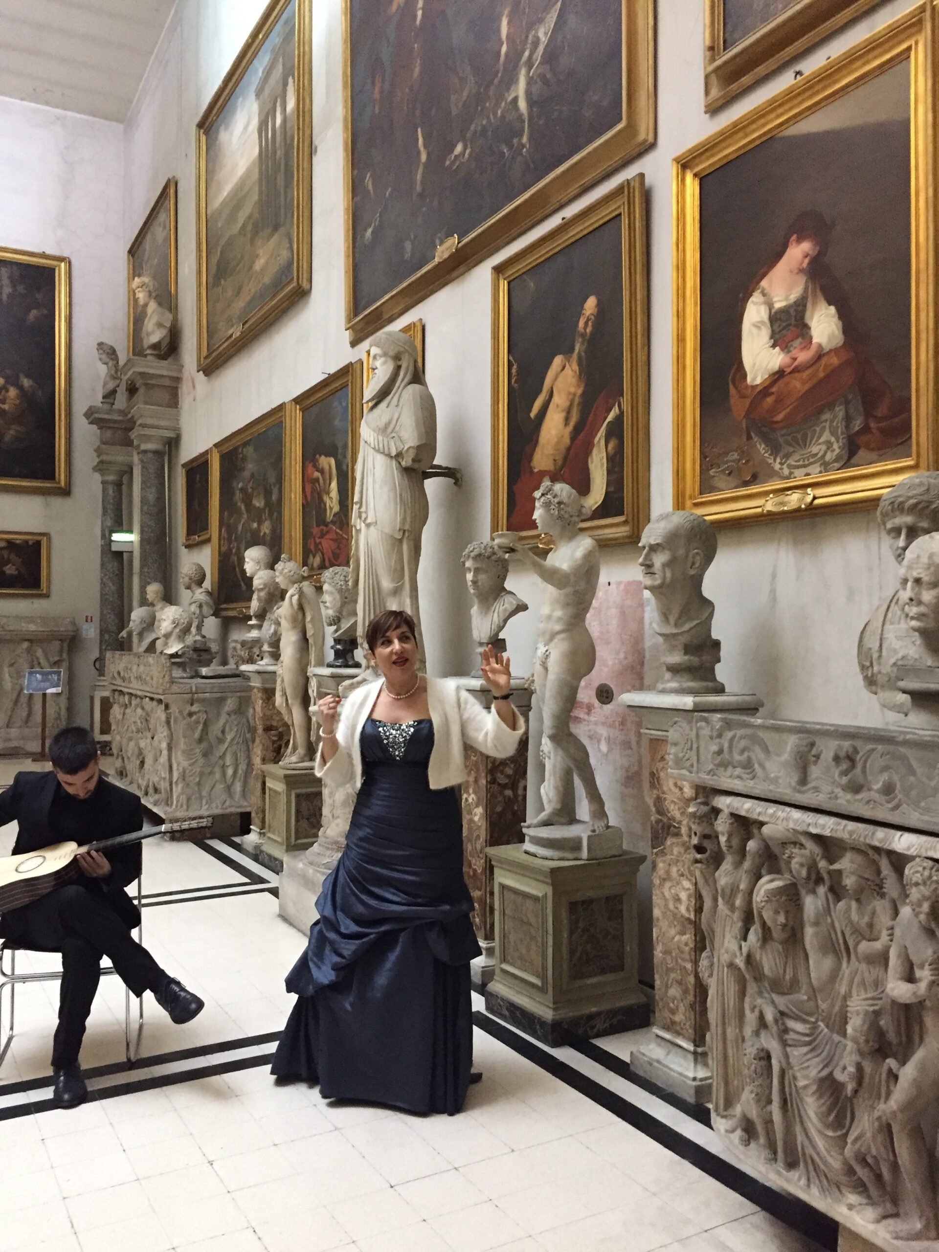 Woman showing art in Rome palace