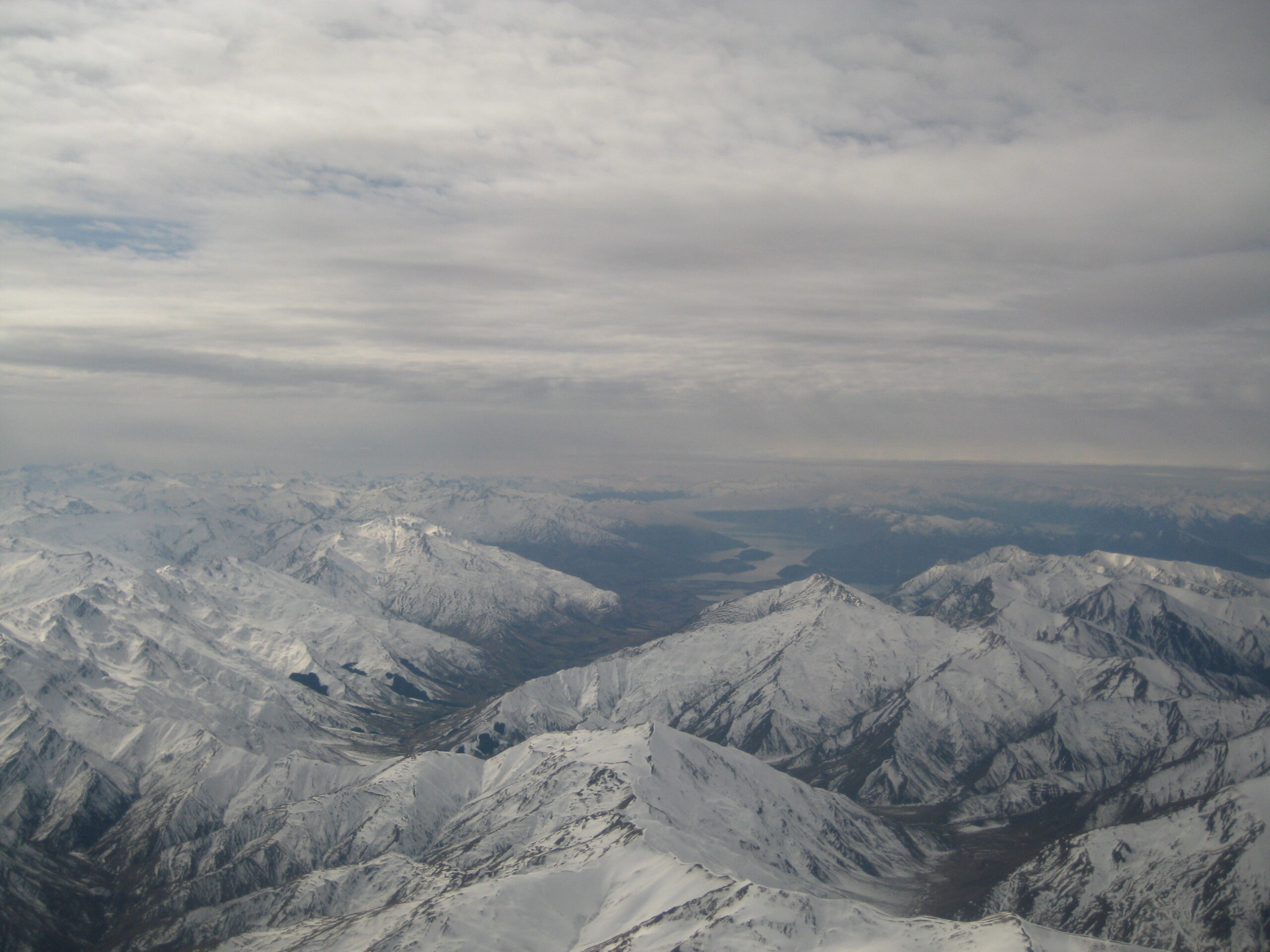 snow capped mountains from the air
