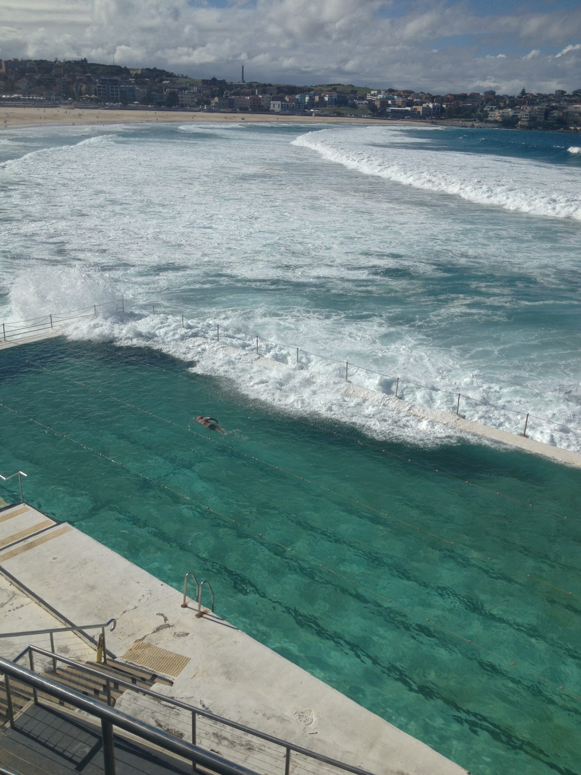 swimming pool next to the ocean