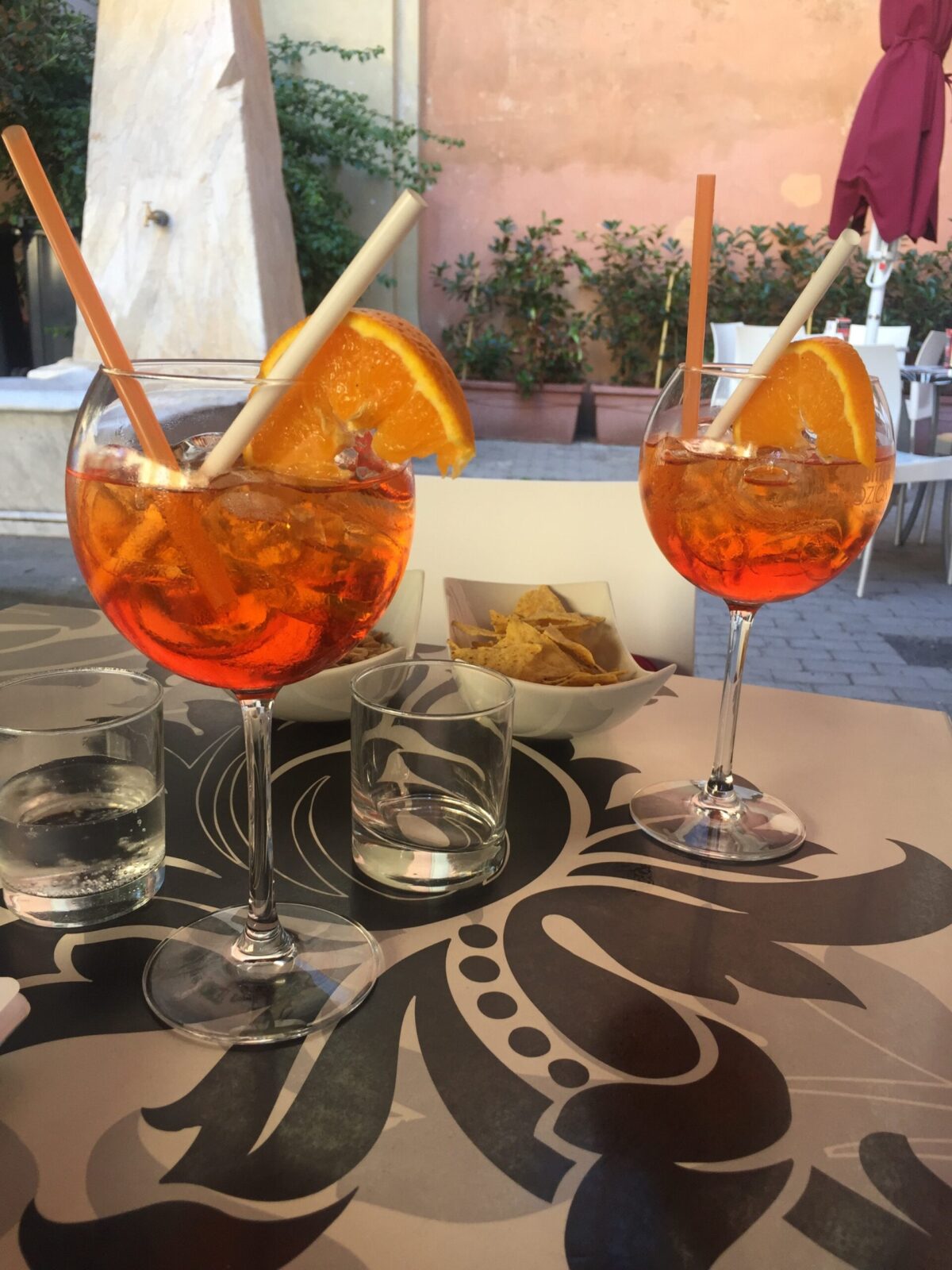 orange colored drink in large glasses